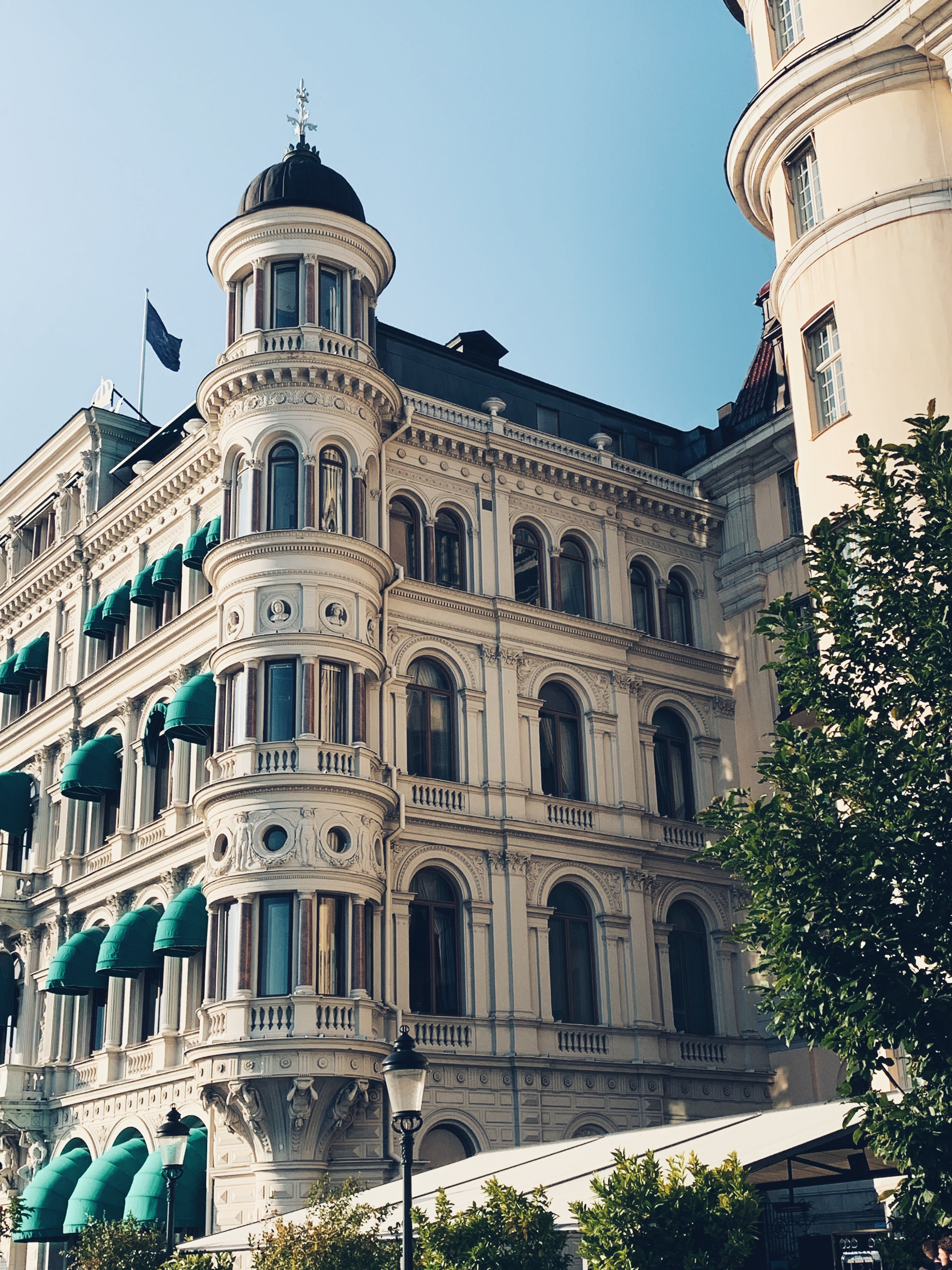 Two people working at a terrazzo table in a modern office